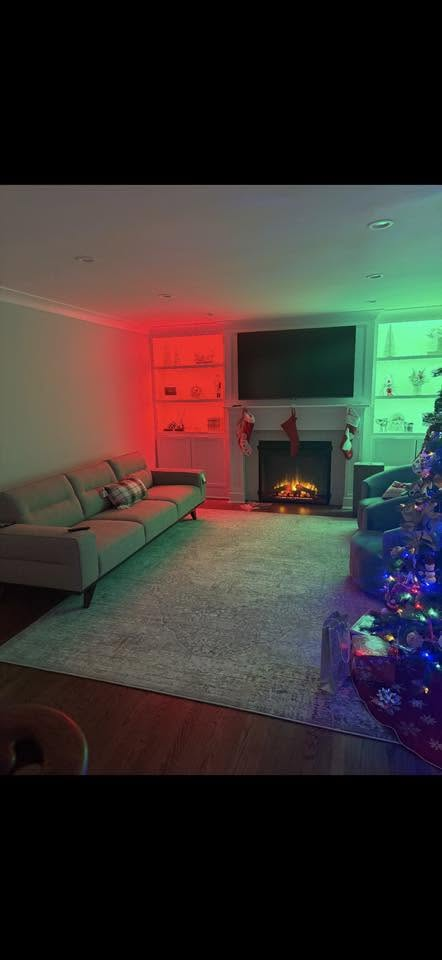 Finished living room renovation with fireplace feature wall and built-ins